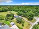 Aerial view of single story home with large lot and lush green surroundings at 106 N Frederick St, Pierson, FL 32180