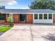 Brick home with white door and sidelights at 106 N Frederick St, Pierson, FL 32180