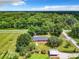 Aerial view of single story home with large lot and lush green surroundings at 106 N Frederick St, Pierson, FL 32180