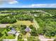 Aerial view of a house on a large lot with surrounding greenery at 106 N Frederick St, Pierson, FL 32180