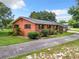 Side view of brick ranch home with carport at 106 N Frederick St, Pierson, FL 32180