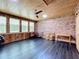 Spacious sunroom with brick feature wall and wood ceiling at 106 N Frederick St, Pierson, FL 32180