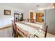 Bright dining area with table and chairs near kitchen and living room at 106 N Frederick St, Pierson, FL 32180