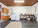 Bright laundry room with washer, dryer, and ample storage at 106 N Frederick St, Pierson, FL 32180
