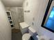 Small workshop bathroom with shower and toilet at 106 N Frederick St, Pierson, FL 32180