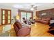 Bright living room featuring hardwood floors and comfortable leather seating at 106 N Frederick St, Pierson, FL 32180
