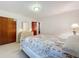 Bedroom with floral bedding and double door closet at 106 N Frederick St, Pierson, FL 32180