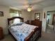 Main bedroom with dresser and ensuite bathroom access at 1612 Juno Trl, Astor, FL 32102