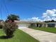 Single-story house with a spacious yard and driveway at 1612 Juno Trl, Astor, FL 32102
