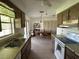 Galley kitchen with ample counter space and appliances at 1612 Juno Trl, Astor, FL 32102