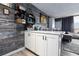 Modern kitchen with white cabinets and marble countertops at 2043 S Atlantic Ave # 308, Daytona Beach, FL 32118