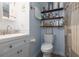 Clean bathroom with updated vanity and shelves at 2043 S Atlantic Ave # 308, Daytona Beach, FL 32118