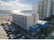 Aerial view of beachfront property, showing building and parking at 2043 S Atlantic Ave # 308, Daytona Beach, FL 32118