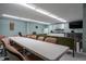 Community room with tables, seating, and kitchenette at 2043 S Atlantic Ave # 308, Daytona Beach, FL 32118