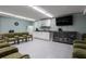 Community room with kitchenette and large screen TV at 2043 S Atlantic Ave # 308, Daytona Beach, FL 32118