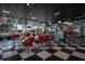 Retro-style diner with red booths and checkered floor at 2043 S Atlantic Ave # 308, Daytona Beach, FL 32118