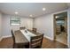 Dining room features a wood table with seating for four and access to a hallway at 1 Cassia Ln, Debary, FL 32713