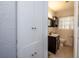 Clean bathroom with dark wood vanity and tiled floor at 1 Cassia Ln, Debary, FL 32713