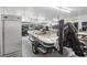 Garage with a bass boat and other equipment at 1582 Covered Bridge Dr, Deland, FL 32724