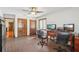 Spacious home office with wood floors and built-in shelving at 1582 Covered Bridge Dr, Deland, FL 32724