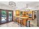 L-shaped kitchen with granite countertops and stainless steel appliances at 1582 Covered Bridge Dr, Deland, FL 32724
