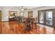 Bright dining area with hardwood floors and seating for six at 1582 Covered Bridge Dr, Deland, FL 32724