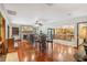 Open concept living space with hardwood floors, fireplace and kitchen views at 1582 Covered Bridge Dr, Deland, FL 32724