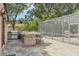 Brick outdoor kitchen with large island and seating area at 1582 Covered Bridge Dr, Deland, FL 32724