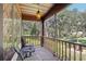 Relaxing screened porch overlooking a lush wooded backyard at 1582 Covered Bridge Dr, Deland, FL 32724