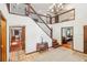 Two-story entryway with a staircase and tile floor at 1582 Covered Bridge Dr, Deland, FL 32724