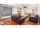 Bright living room with hardwood floors, fireplace, and large window at 1582 Covered Bridge Dr, Deland, FL 32724