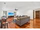 Living room with hardwood floors, large TV, and comfortable seating at 1582 Covered Bridge Dr, Deland, FL 32724