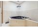 Bathroom with corner jetted tub, tiled walls, and a modern design at 1582 Covered Bridge Dr, Deland, FL 32724