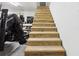 Unfinished wooden stairs leading to the basement at 1582 Covered Bridge Dr, Deland, FL 32724