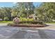 Circular garden bed with shrubs, in front of a house at 1582 Covered Bridge Dr, Deland, FL 32724