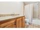 Bathroom with granite countertop and tiled shower/tub at 1582 Covered Bridge Dr, Deland, FL 32724