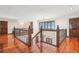 Upper landing with hardwood floors and a chandelier at 1582 Covered Bridge Dr, Deland, FL 32724