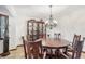 Formal dining room with chandelier and display cabinet at 1582 Covered Bridge Dr, Deland, FL 32724