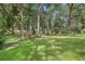 Large lot with mature trees and open grassy areas at 1582 Covered Bridge Dr, Deland, FL 32724