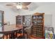 Dining room with wooden table, wine storage, and hardwood floors at 1582 Covered Bridge Dr, Deland, FL 32724