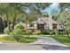 Two-story house with a circular driveway and landscaping at 1582 Covered Bridge Dr, Deland, FL 32724
