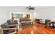 Open living area with hardwood floors and ample seating at 1582 Covered Bridge Dr, Deland, FL 32724