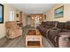 Living room with a comfortable recliner, coffee table, and neutral color scheme at 2711 N Halifax Ave # 296, Daytona Beach, FL 32118