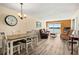 Bright dining area with wood floors and a chandelier at 2711 N Halifax Ave # 296, Daytona Beach, FL 32118