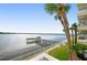 Stunning waterfront view with private pier and lush tropical landscaping at 2711 N Halifax Ave # 296, Daytona Beach, FL 32118
