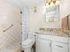 Clean bathroom with granite countertop and shower/tub combo at 2711 N Halifax Ave # 296, Daytona Beach, FL 32118