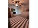 Spacious bedroom featuring a comfortable bed and scenic wall art at 1871 Riveredge Dr, Astor, FL 32102