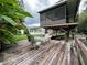 Elevated deck with seating area overlooking the backyard at 1871 Riveredge Dr, Astor, FL 32102
