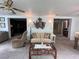 Bright living room featuring comfy seating and a unique nautical wall piece at 1871 Riveredge Dr, Astor, FL 32102