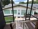 Back exterior view showing house and steps down to deck at 1871 Riveredge Dr, Astor, FL 32102
